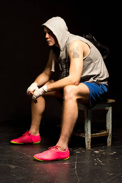 istock Bored young boxer waiting for his match 487274967