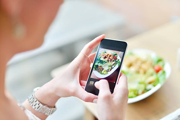 istock Smartphone taking picture from salad 487276459