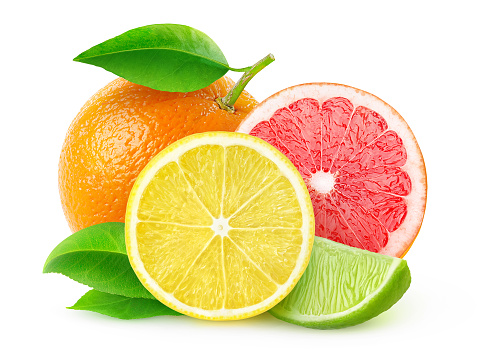 Several citrus fruits cut in half\n in a plate