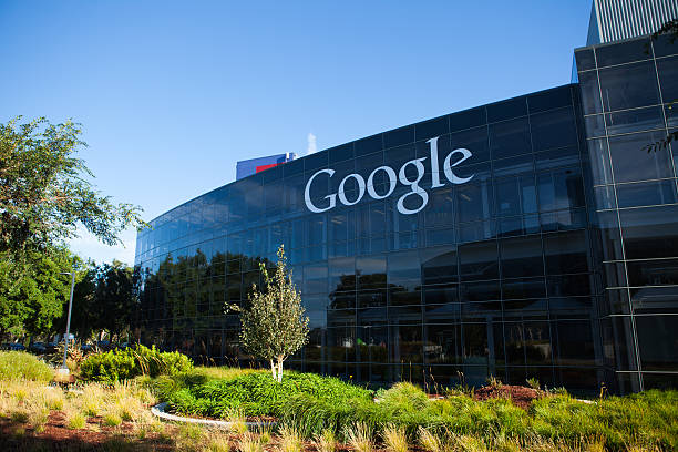 Google Headquarters Mountain View, USA - August 28, 2015: Big Google logotype on the glass office building at Google Headquarters office located at Mountain View, California google brand name photos stock pictures, royalty-free photos & images