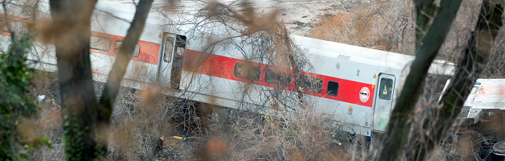 Bronx, New York, USA - November 29, 2013: A Metro North train accident after it experienced a derailment after going too fast.