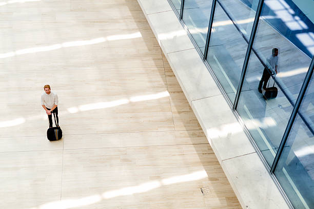 istock Handsome business holding a trolley 487288470