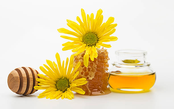 istock Fresh honey in a jar and honey dipper 487291190