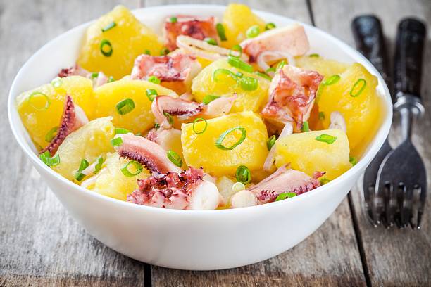istock Italian food: salad with octopus, potatoes and onions 487292088