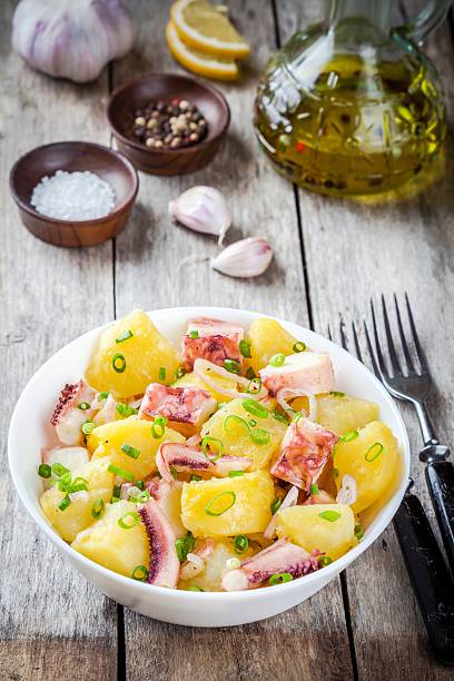 istock Italian food: salad with octopus, potatoes and onions 487292090