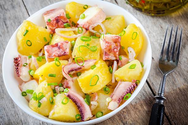 istock Italian food: salad with octopus, potatoes and onions 487292094