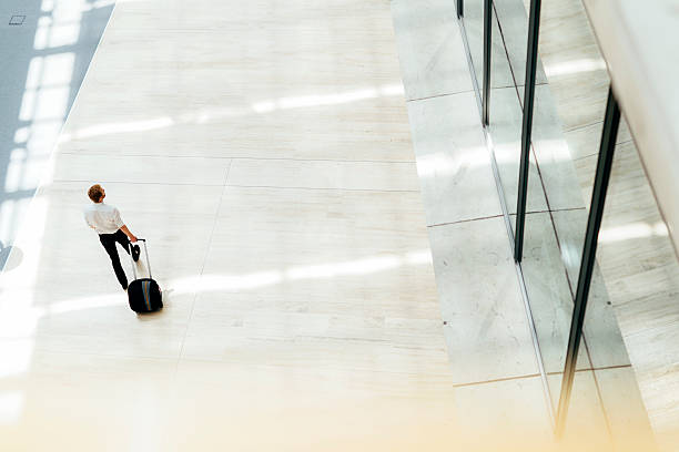 istock Handsome business holding a trolley 487294248