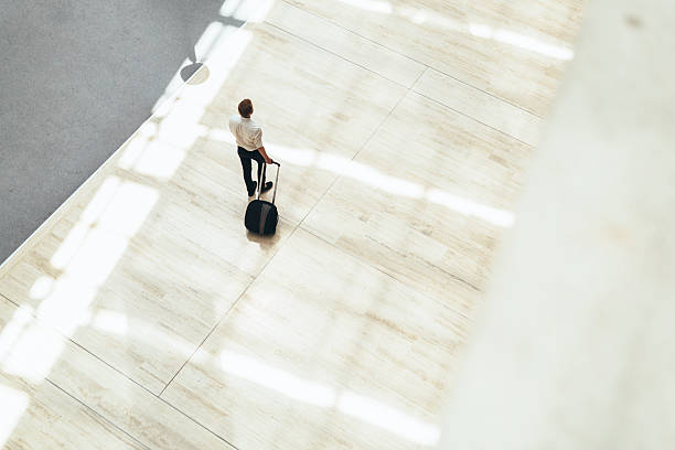 istock Handsome business holding a trolley 487294252