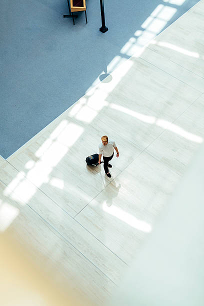 istock Handsome business holding a trolley 487294260