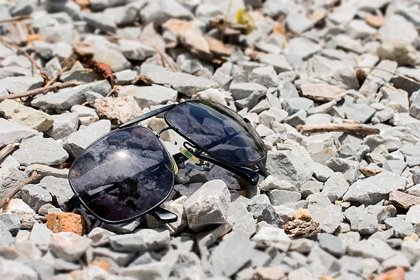 istock Sun glasses on the rock in daylight 487294758