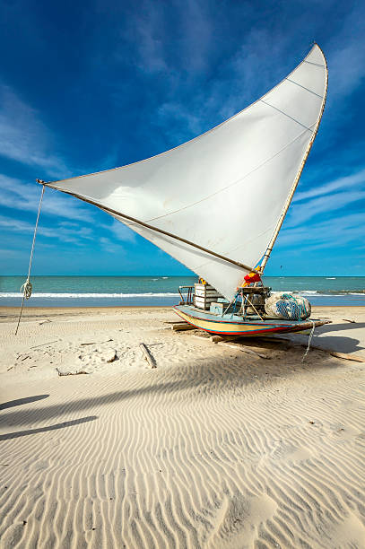 Traditional small fishing boat on the beach of Fortaleza, Brazil Traditional small fishing boat on the beach of Fortaleza, Brazil ceará state brazil stock pictures, royalty-free photos & images