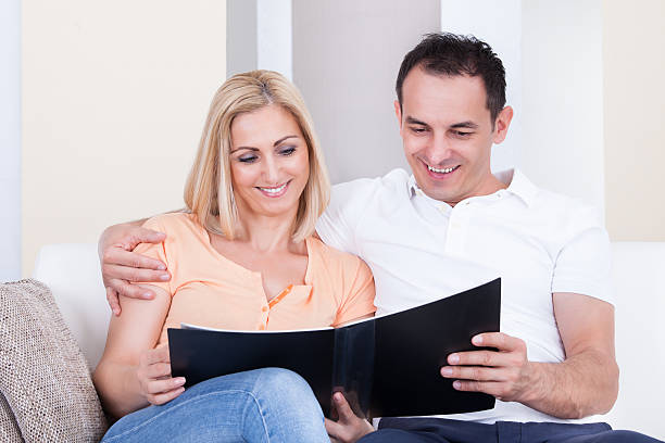 istock Couple Looking At Album 487295867