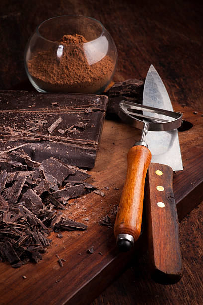 istock Cut Chocolate bars and cocoa powder on a wooden table 487297187