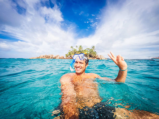 Swimmer Selfie In A Tropical Sea Swimmer Selfie In A Tropical Sea la digue island photos stock pictures, royalty-free photos & images