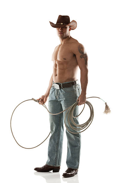 istock Shirtless cowboy holding lasso 487300813