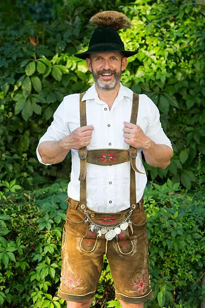 Photo of portrait of bavarian man in lederhosen