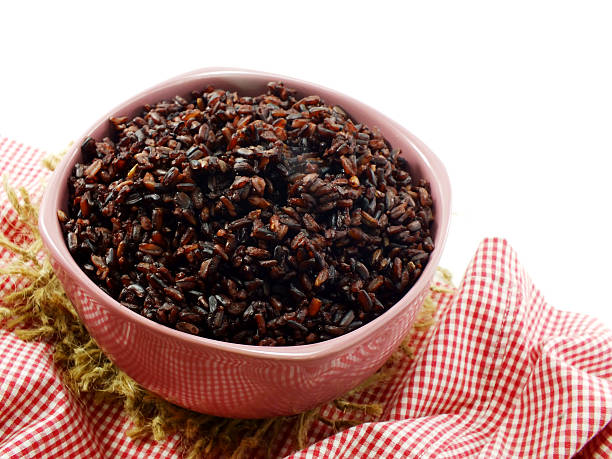 istock rice berry in bowl on white background 487312286