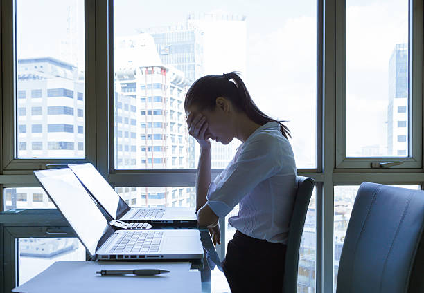 istock Stressed young businesswoman 487313834