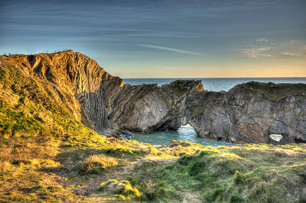 istock Lulworth Cove at sunset 487314622