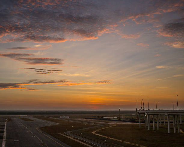 istock passenger plane fly up over take-off runway from airport 487314952