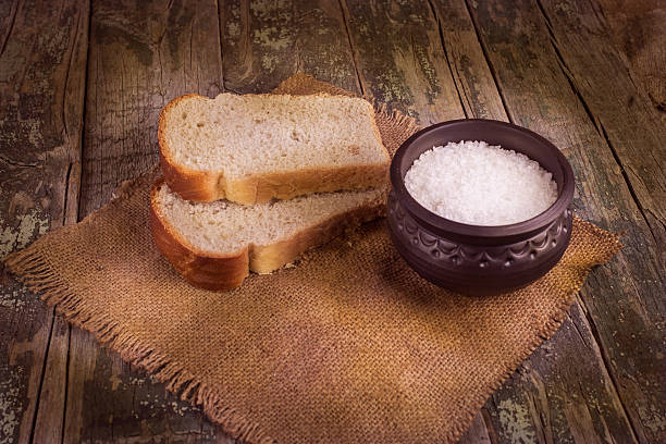 istock bread, salt, on a background of boards and burlap 487316882