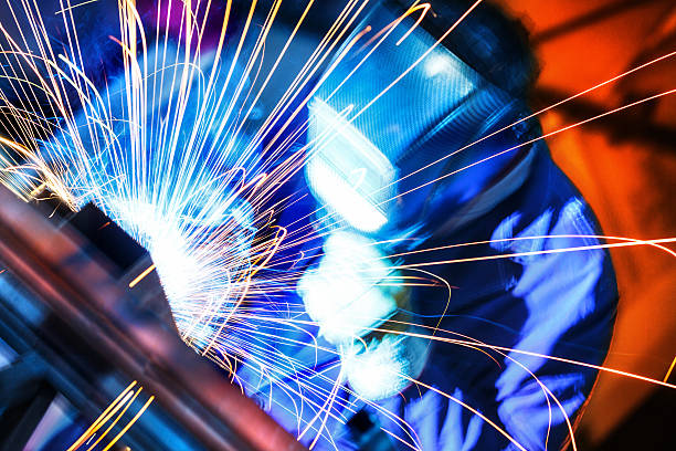 Welding two pieces of metal.