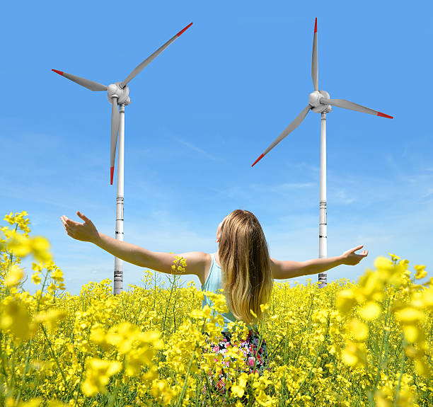istock woman on blooming rapeseed field 487320258