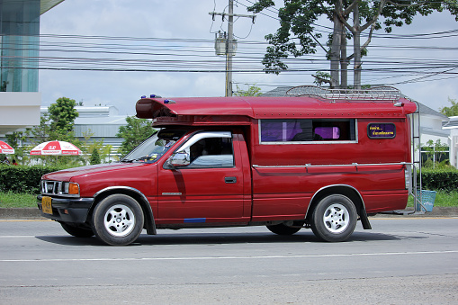 Chiangmai, Thailand -August 13, 2015:  Red taxi chiangmai, Service in city and around. Photo at road no.121 about 8 km from downtown Chiangmai, thailand.