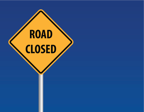 Vector of road closed sign with blue sky background.