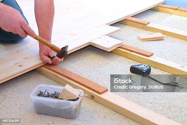 Installing Parquet Floor Stock Photo - Download Image Now - Adjusting, Adult, Adults Only
