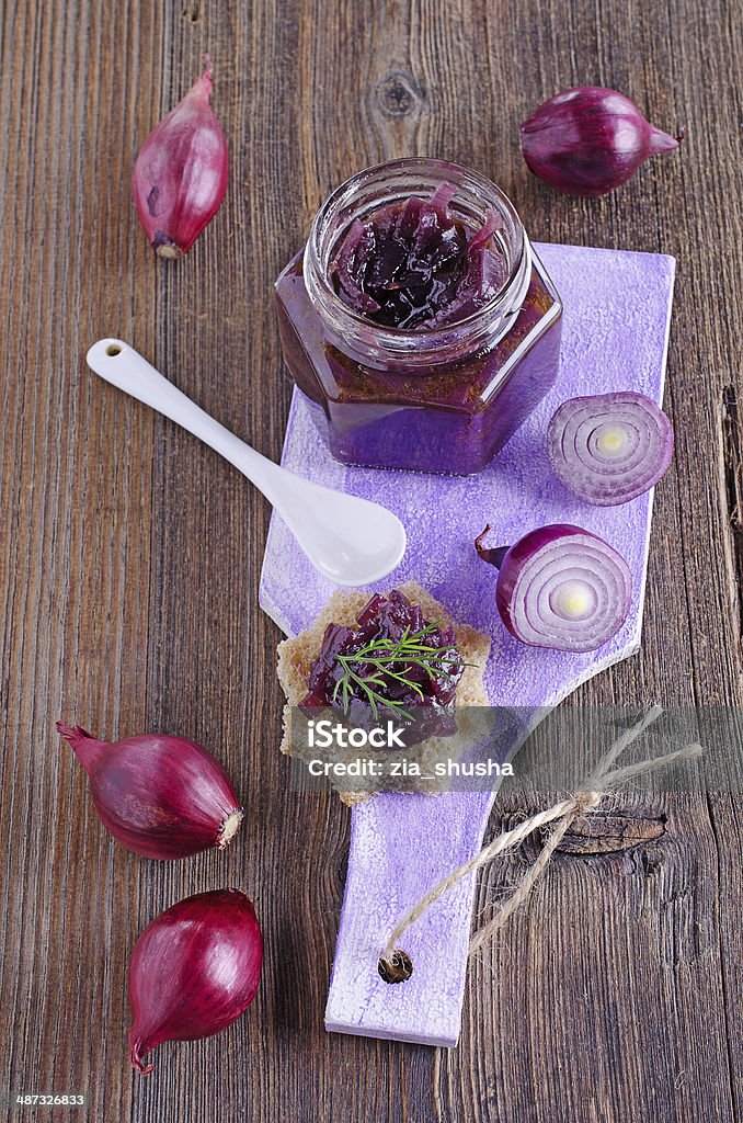 onion marmalade canape with red onion marmalade lying on a cutting board Appetizer Stock Photo