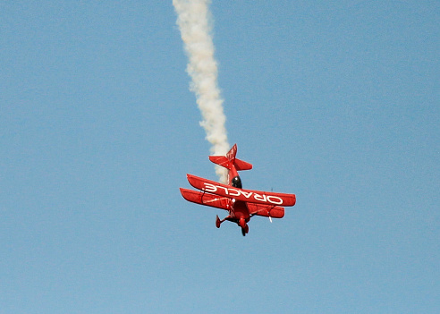 Dayton, OH, USA - June 21 2015: Team Oracle pilot Sean D. Tucker demonstrates aerobatic skills in his Oracle Challenger III biplane during the Dayton International Airshow 2015