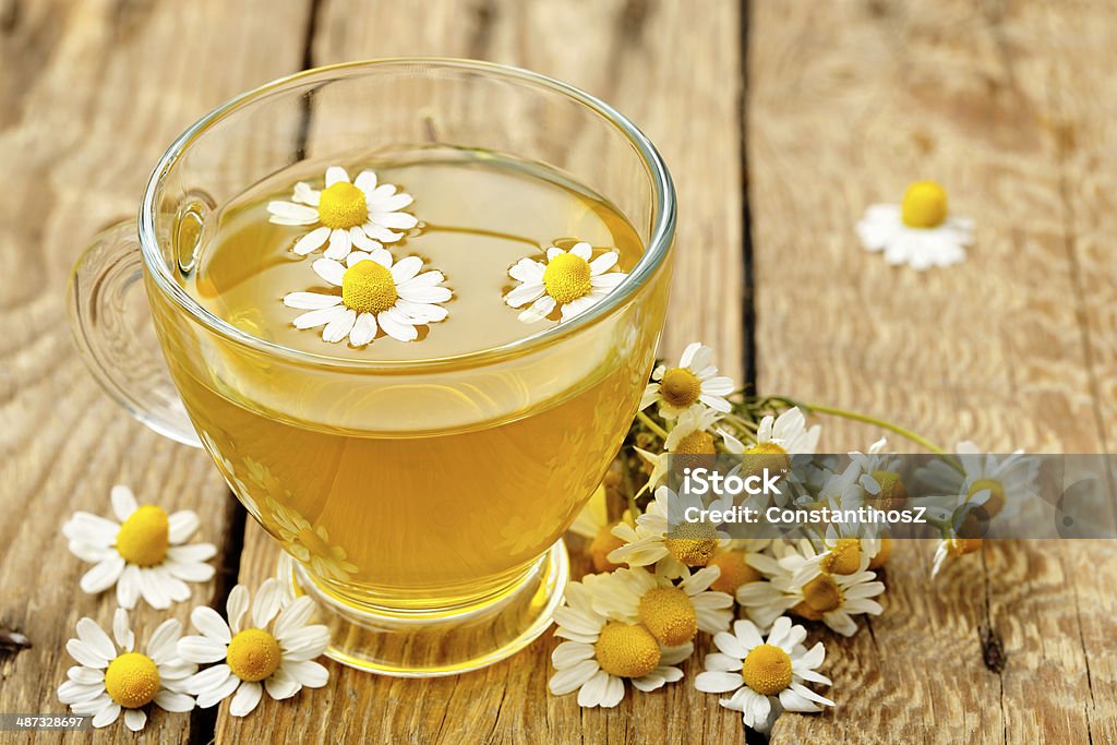 chamomile tea cup of chamomile tea with chamomile flowers Chamomile Stock Photo