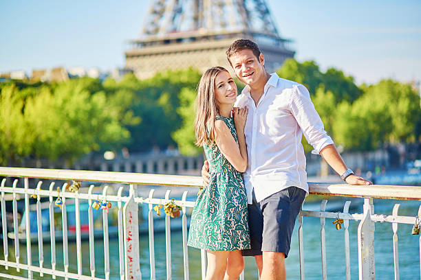 istock Young romantic couple having a date near the Eiffel tower 487329010