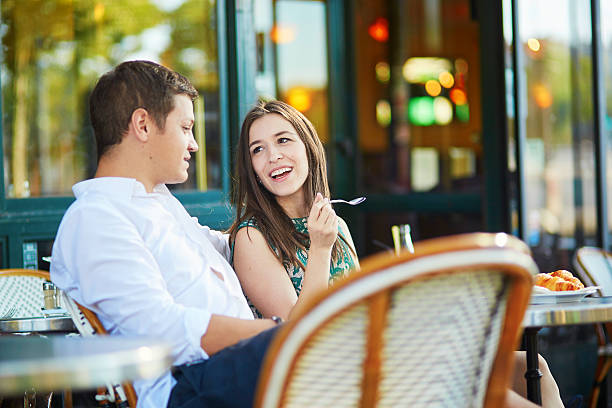 istock Young romantic couple in Parisian cafe 487330218