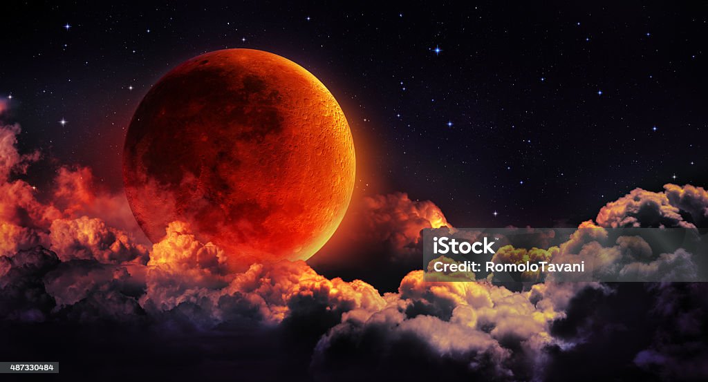 moon eclipse planetary moon red blood with clouds Lunar Eclipse Stock Photo