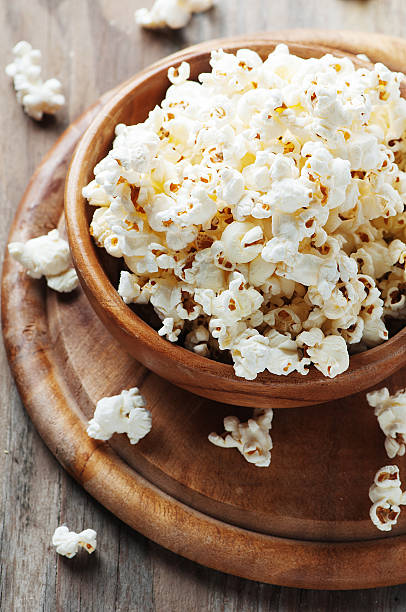 istock Salt popcorn on the wooden table 487331998