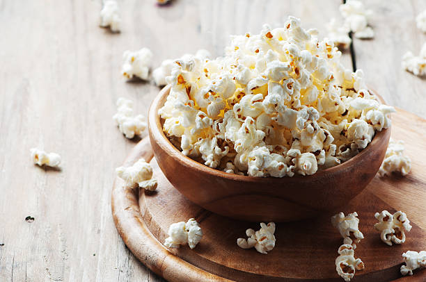 istock Salt popcorn on the wooden table 487332002