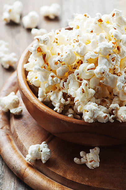 istock Salt popcorn on the wooden table 487332004