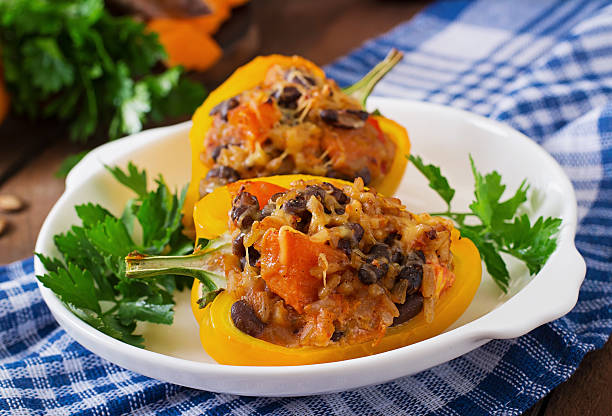 istock Stuffed peppers with rice, beans and pumpkin 487332060