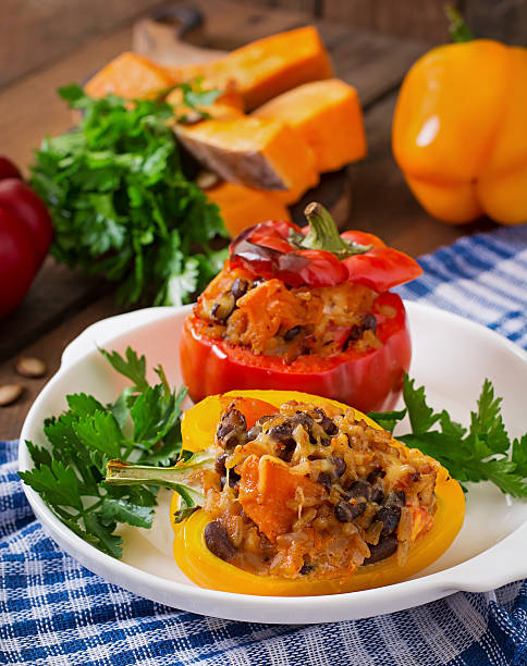 istock Stuffed peppers with rice, beans and pumpkin 487332064