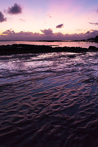 istock Beautiful rock patterns and sunrise at shore 487334396
