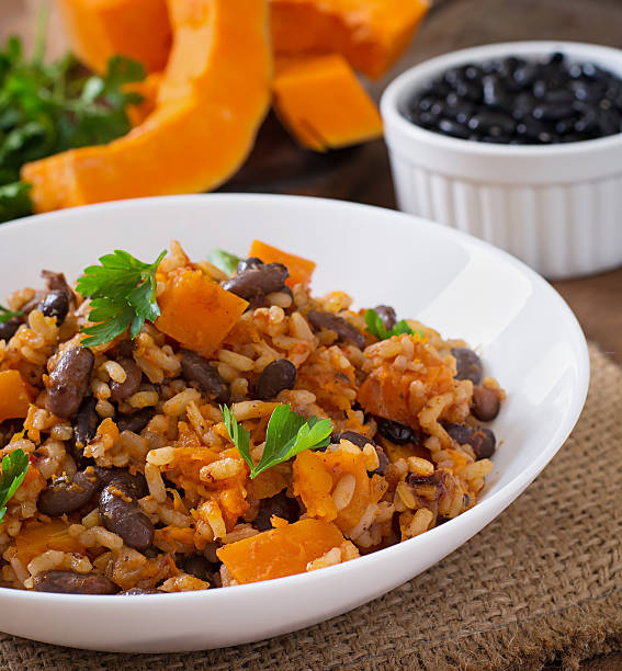 istock Mexican vegan vegetable pilaf with haricot beans and pumpkin 487334548