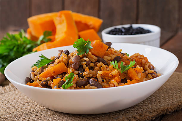 istock Mexican vegan vegetable pilaf with haricot beans and pumpkin 487334550