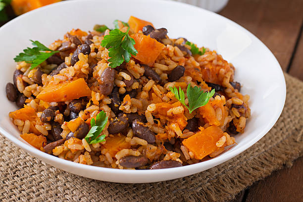 istock Mexican vegan vegetable pilaf with haricot beans and pumpkin 487334552