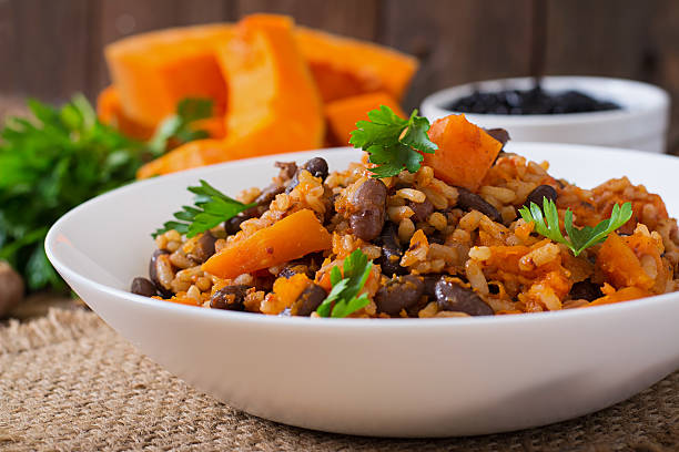 istock Mexican vegan vegetable pilaf with haricot beans and pumpkin 487334586