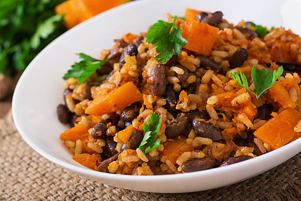 istock Mexican vegan vegetable pilaf with haricot beans and pumpkin 487334588