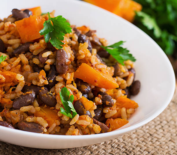 istock Mexican vegan vegetable pilaf with haricot beans and pumpkin 487334590