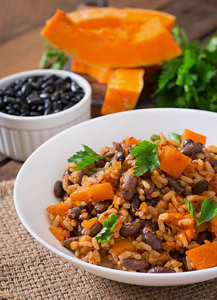 istock Mexican vegan vegetable pilaf with haricot beans and pumpkin 487334600