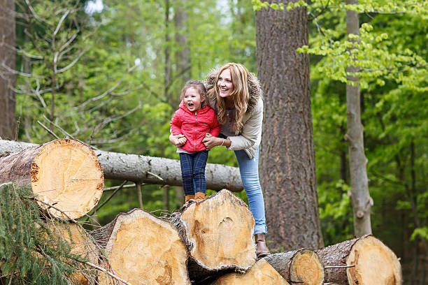 istock Mother and child outdoors playing, kissing and hugging 487334974